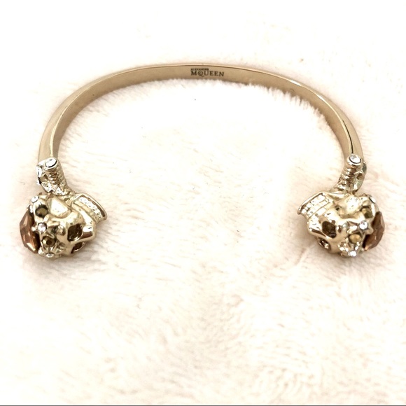 Alexander McQueen Jewelry - ALEXANDER MCQUEEN TWIN SKULL GOLD TONE BANGLE BRACELET